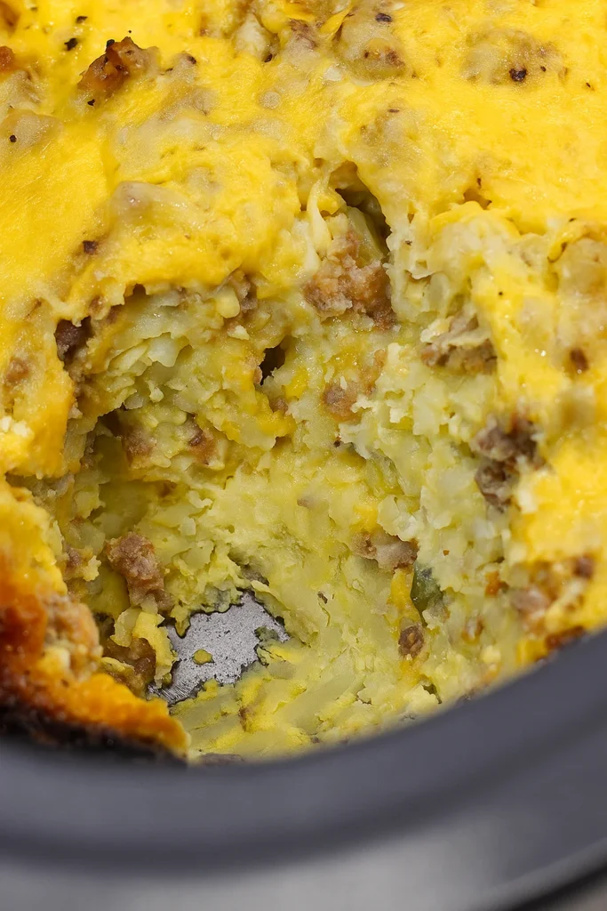 Served Crockpot Breakfast Casserole topped with avocado and salsa